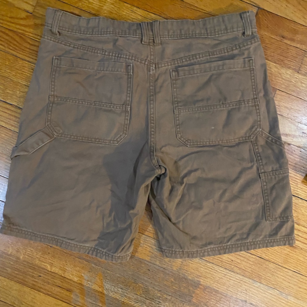 Original use brown cargo shorts with dbl covering at front of shorts size 34”